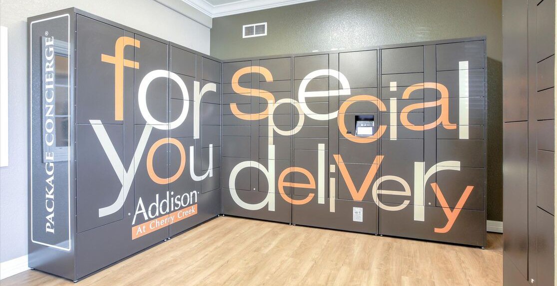 Wrapped package locker with 'special delivery for you' text and apartment logo